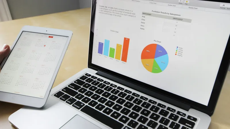 Laptop displaying per diem charts and expense tracking calculations