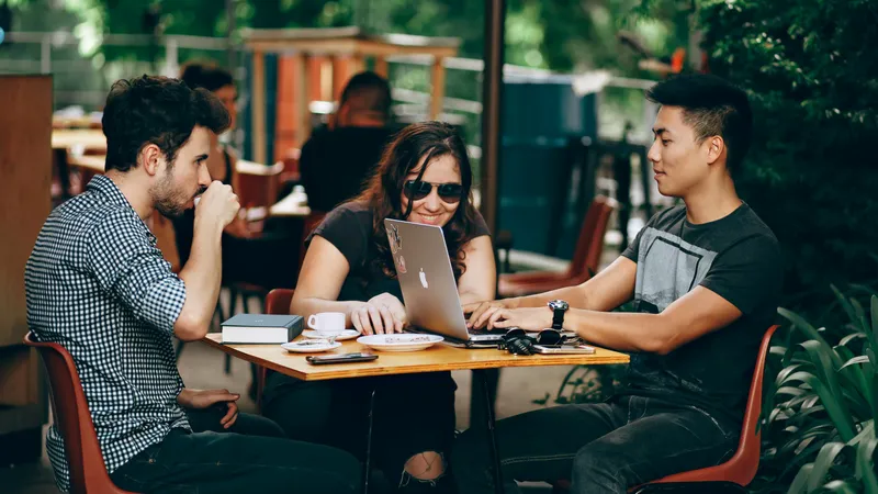 Team members having a catch-up meeting in an outdoor setting